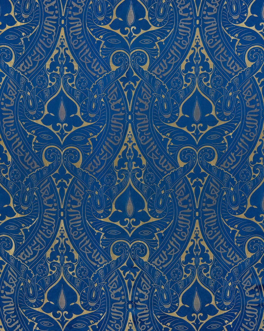 Close-up of deep blue and gold ornamental damask wallpaper